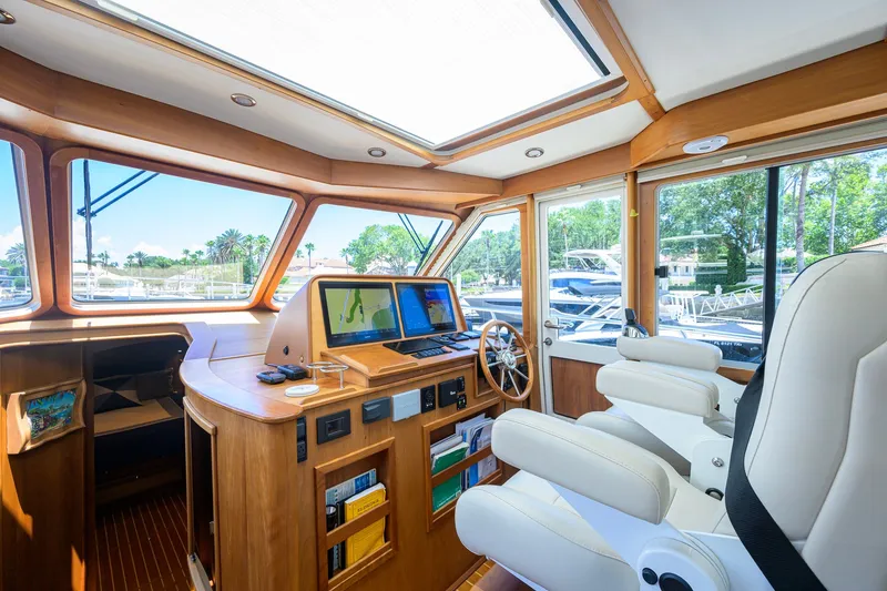 Slide: The Image of Interior of 2018 Sabre 45 Salon Express yacht with modern navigation equipment and luxurious seating. - 43
