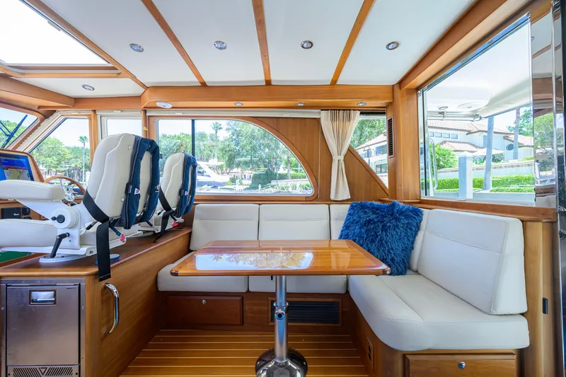Slide: The Image of Interior of 2018 Sabre 45 Salon Express yacht with plush seating and wooden accents. - 31