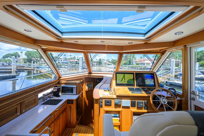 Slide: The Image of Luxurious interior of 2018 Sabre 45 Salon Express yacht with panoramic windows and modern navigation. - 40