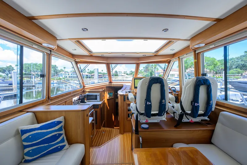 Slide: The Image of Interior of 2018 Sabre 45 Salon Express yacht, featuring luxurious seating and panoramic windows. - 46