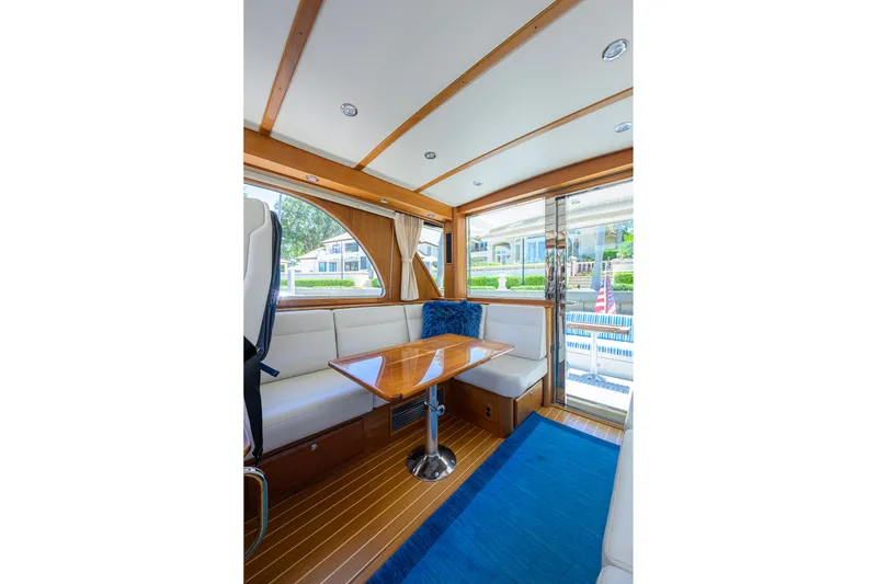 Slide: The Image of Interior of 2018 Sabre 45 Salon Express yacht with elegant wood finish and seating area. - 32
