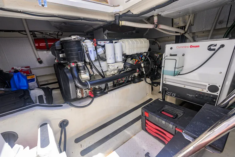 Slide: The Image of Engine room of 2018 Sabre 45 Salon Express with Cummins Onan generator and tools. - 65