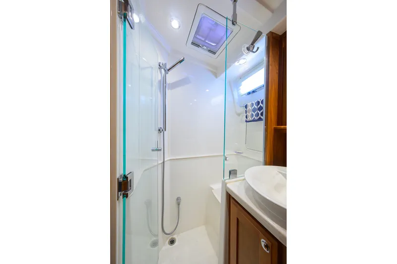 Slide: The Image of 2018 Sabre 45 Salon Express bathroom with glass shower and modern fixtures. - 17