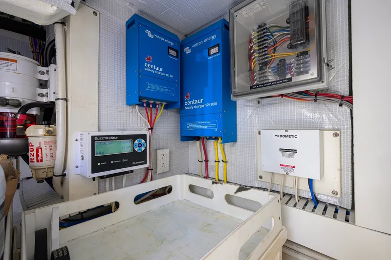 Slide: The Image of Electrical system setup in a 2018 Sabre 45 Salon Express yacht, featuring Victron Energy components. - 63