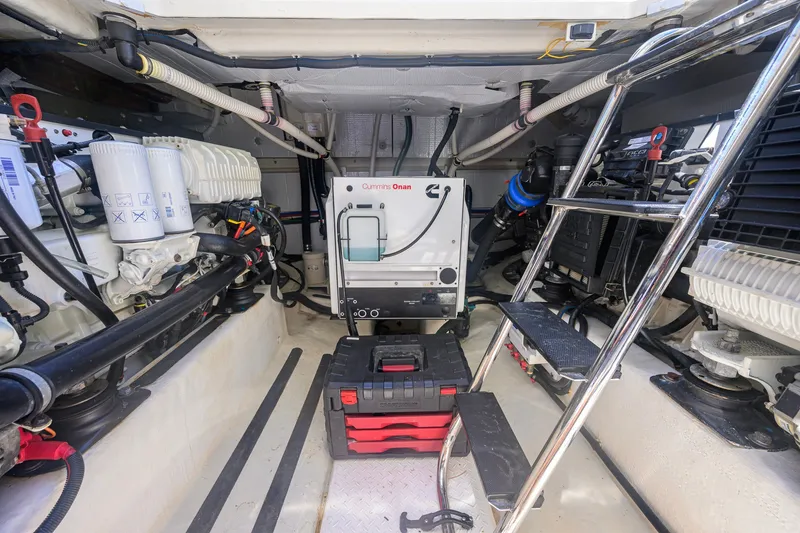 Slide: The Image of Engine room of 2018 Sabre 45 Salon Express with Cummins generator and organized tool storage. - 59