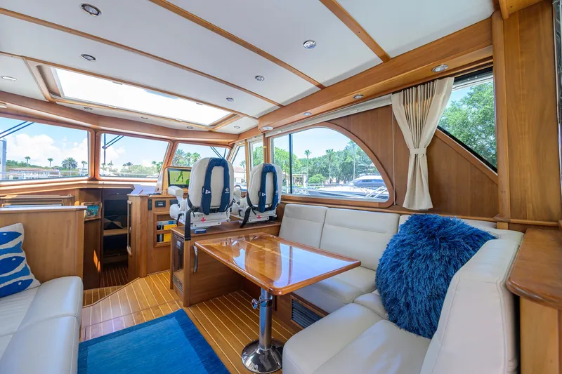Slide: The Image of Interior of 2018 Sabre 45 Salon Express yacht with luxurious seating and panoramic windows. - 30