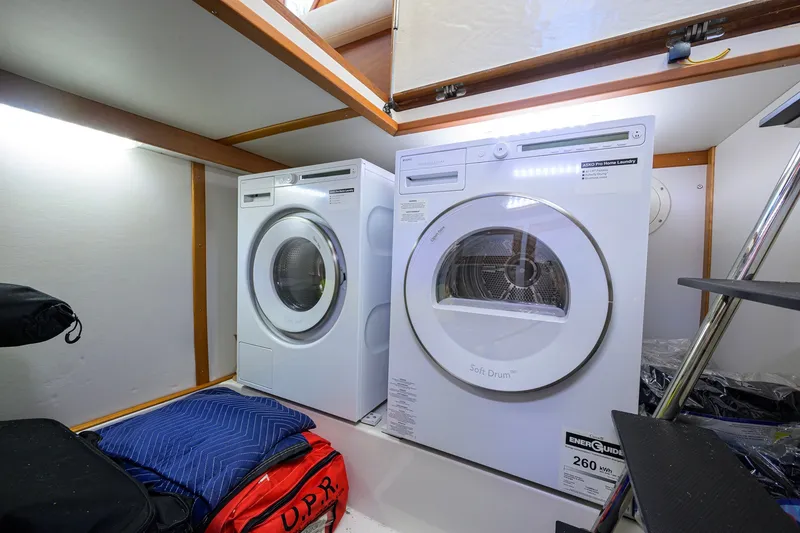 Slide: The Image of Laundry area with washer and dryer inside 2018 Sabre 45 Salon Express yacht. - 57