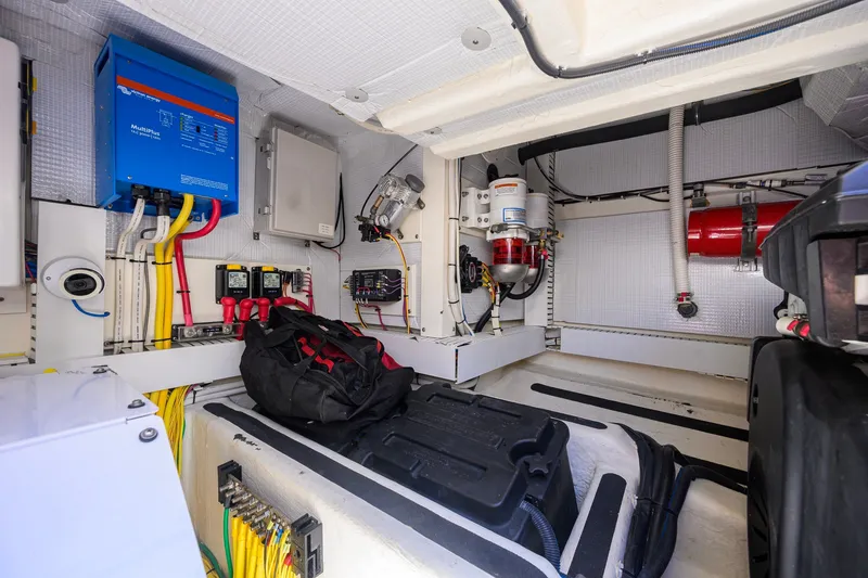 Slide: The Image of Engine room of 2018 Sabre 45 Salon Express with electrical components and wiring. - 64