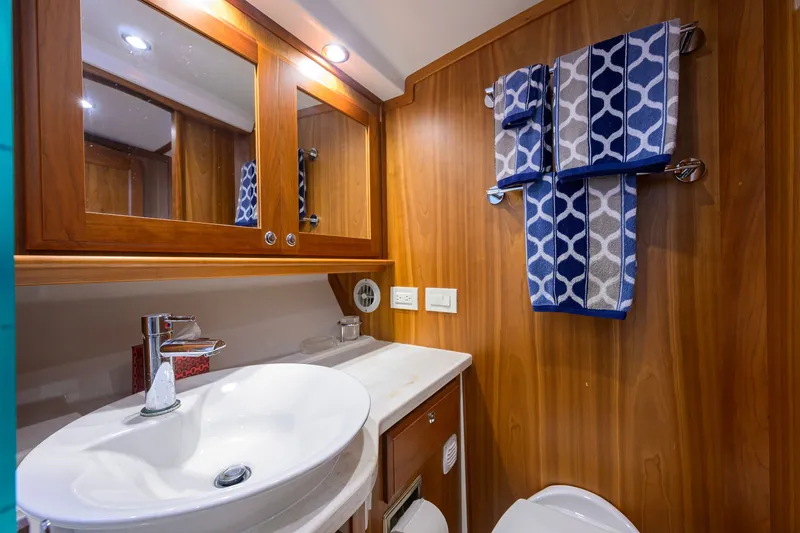 Slide: The Image of Luxurious bathroom in 2018 Sabre 45 Salon Express yacht with elegant wood finish. - 16