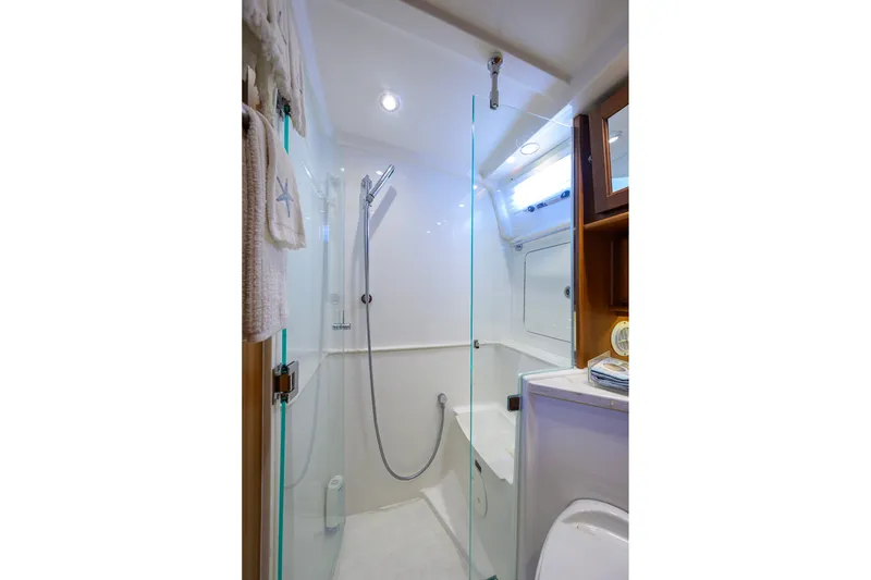 Slide: The Image of Luxurious bathroom in 2018 Sabre 45 Salon Express yacht with glass shower enclosure. - 24