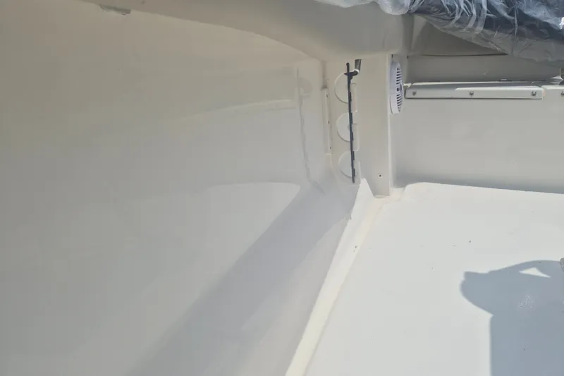 Slide: The Image of Interior view of 2026 Key West 203 FS boat, showcasing sleek white design. - 12