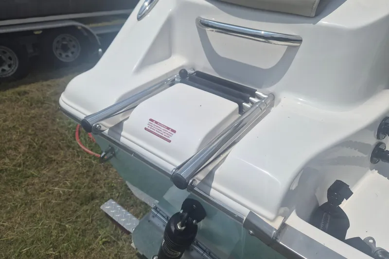 Slide: The Image of 2026 Key West 203 FS boat with a folded swim ladder on the deck. - 4