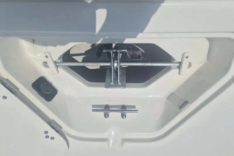 Slide: The Image of Anchor compartment of 2026 Key West 203 FS boat, featuring secure metal fittings. - 18