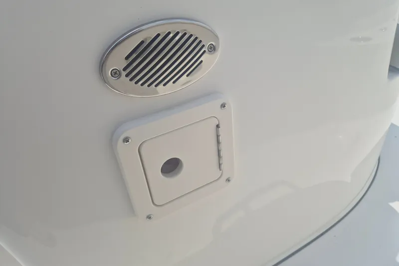 Slide: The Image of Close-up of a 2026 Key West 203 FS boat's speaker and access panel. - 13