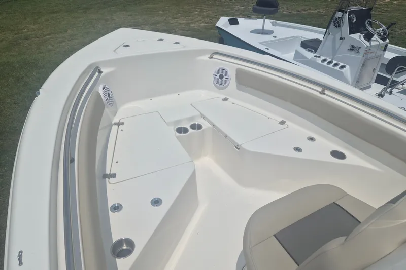 Slide: The Image of 2026 Key West 203 FS boat interior with seating and cup holders. - 16