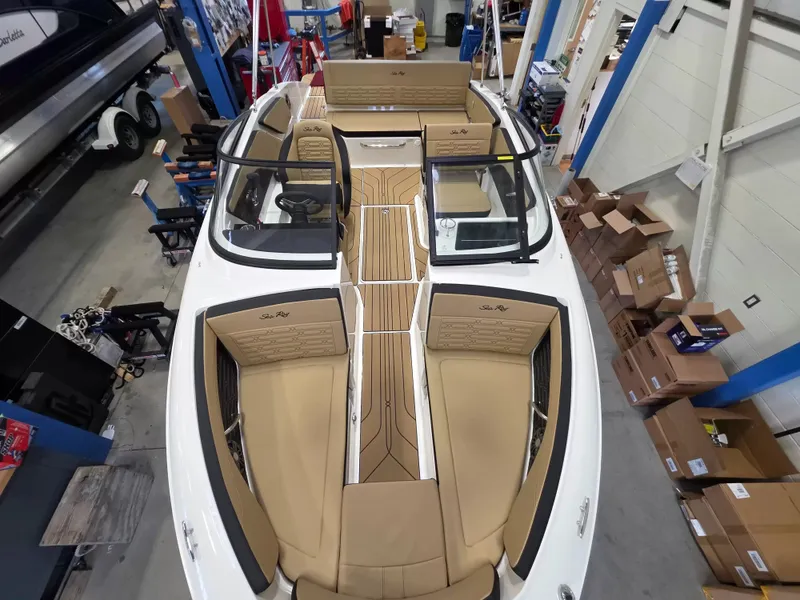 Slide: The Image of Sea Ray SPX 210 2027: Spacious deck with beige upholstery and modern design. - 20