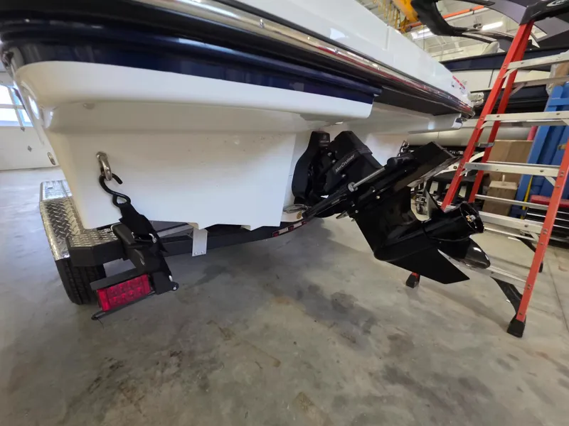 Slide: The Image of The image shows the stern of a Sea Ray SPX 210 boat with an outboard motor. - 6