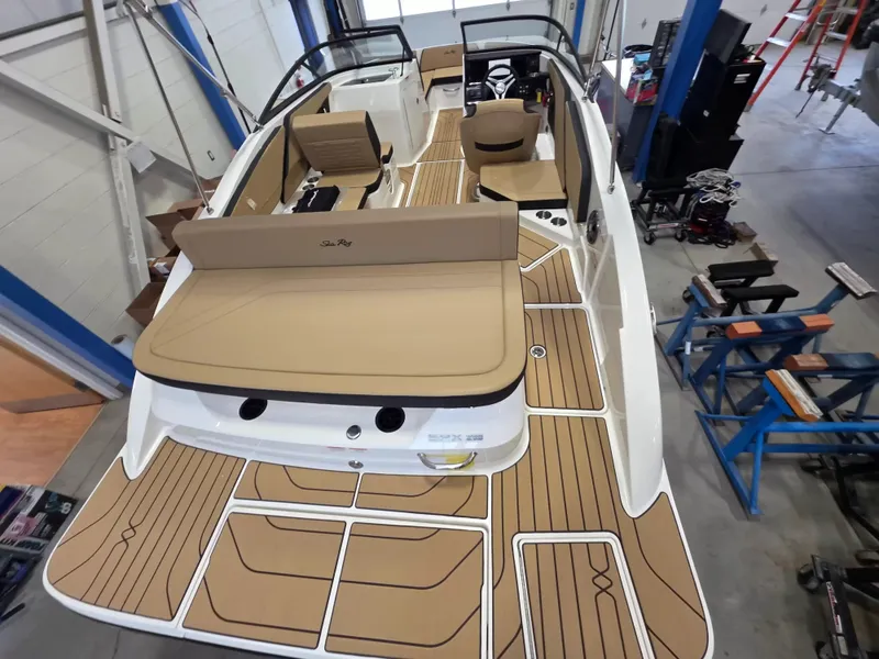 Slide: The Image of The image shows a 2027 Sea Ray SPX 210 boat with a spacious, modern deck. - 8