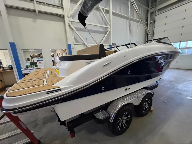 Slide: The Image of A 2027 Sea Ray SPX 210 boat on a trailer inside a warehouse. - 7
