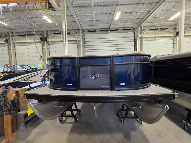 Slide: The Image of A 2027 Barletta ARIA 22UC pontoon boat in a storage facility. - 3