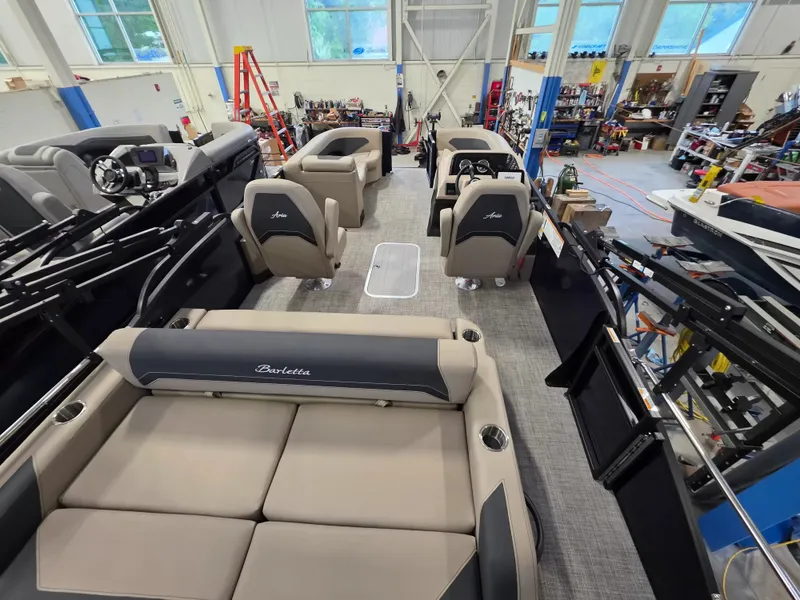 Slide: The Image of Interior of a 2027 Barletta ARIA 22UC with gray and beige seating. - 10