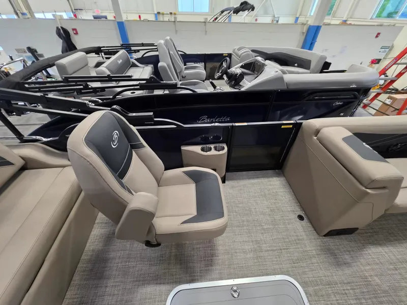 Slide: The Image of Interior of a Barletta ARIA 22UC pontoon boat with gray seating and modern design. - 19