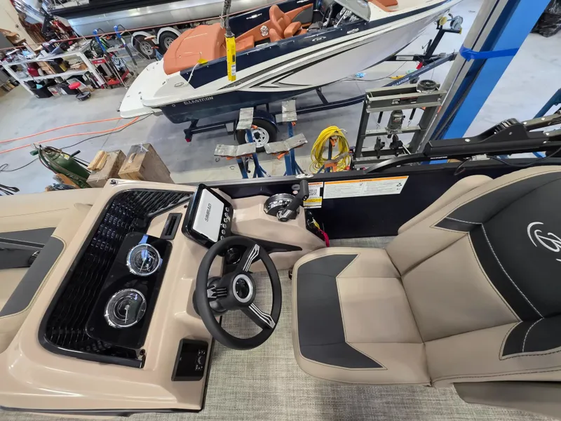 Slide: The Image of The image shows the cockpit of a 2027 Barletta ARIA 22UC with a modern helm station. - 13