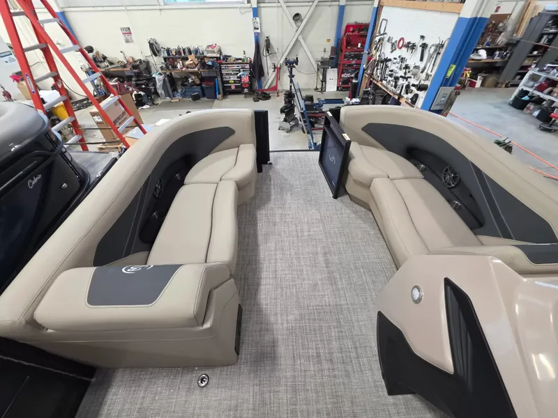 Slide: The Image of The image shows the interior of a Barletta ARIA 22UC boat with beige seating. - 21