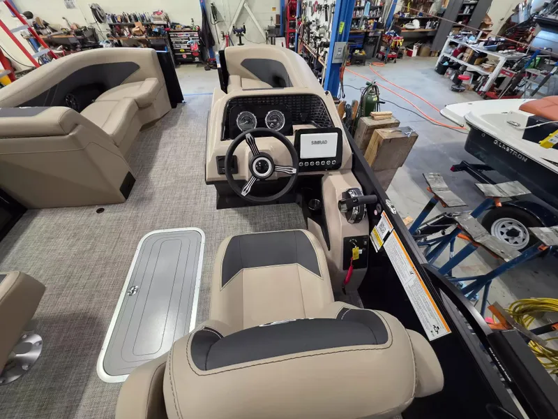 Slide: The Image of The image shows the cockpit of a 2027 Barletta ARIA 22UC with modern instruments and comfortable seating. - 12