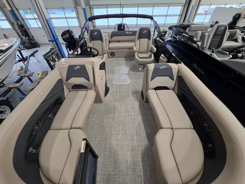 Slide: The Image of Interior view of a 2027 Barletta ARIA 22UC with beige seating and gray flooring. - 24