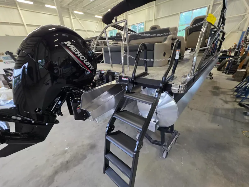 Slide: The Image of 2027 Barletta ARIA 22UC with Mercury outboard motor and ladder in a warehouse. - 8