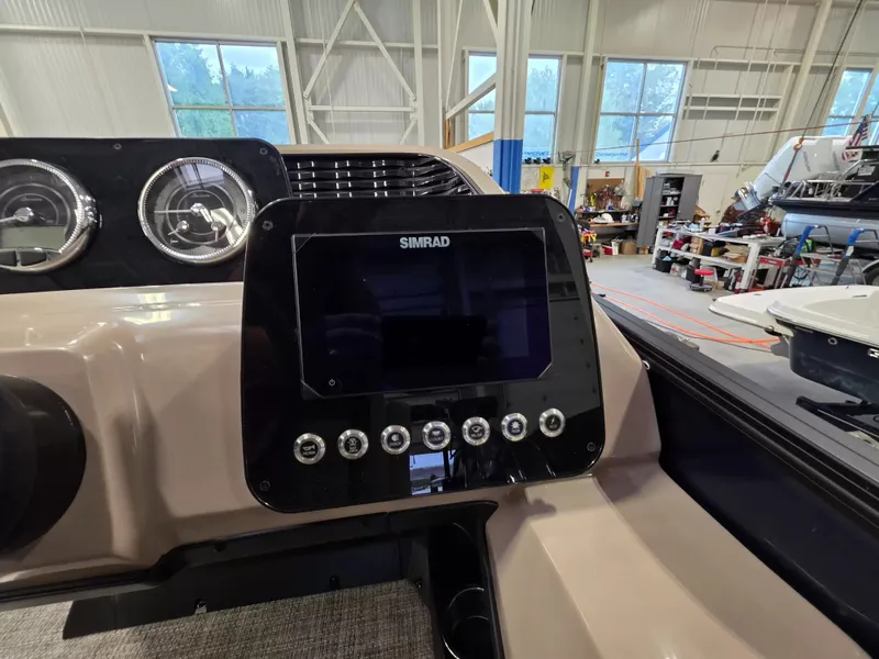 Slide: The Image of The image shows the dashboard of a Barletta ARIA 22UC with a Simrad display. - 16