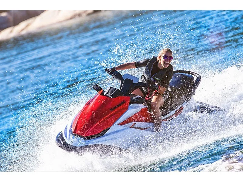 Slide: The Image of A person rides a red Kawasaki JET SKI STX 160 on the water. - 8