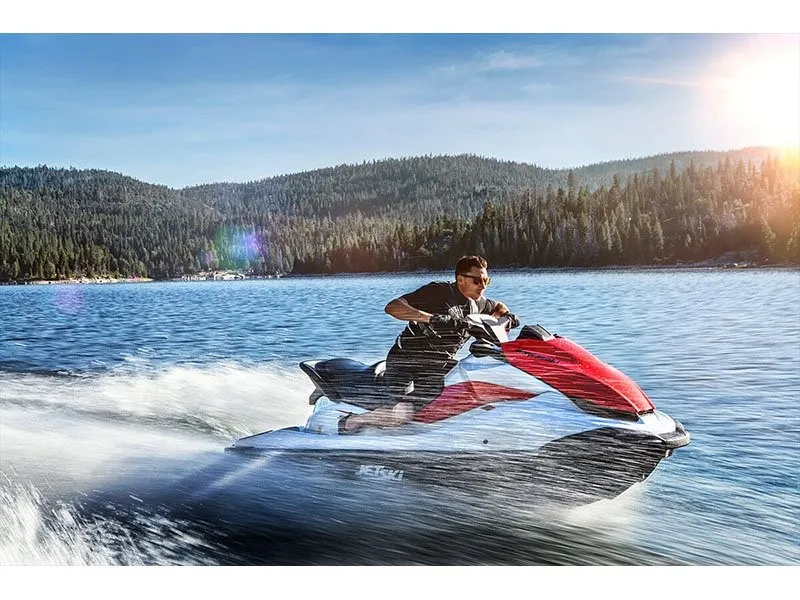 Slide: The Image of A man rides a Kawasaki JET SKI STX 160 on a lake under sunny skies. - 12