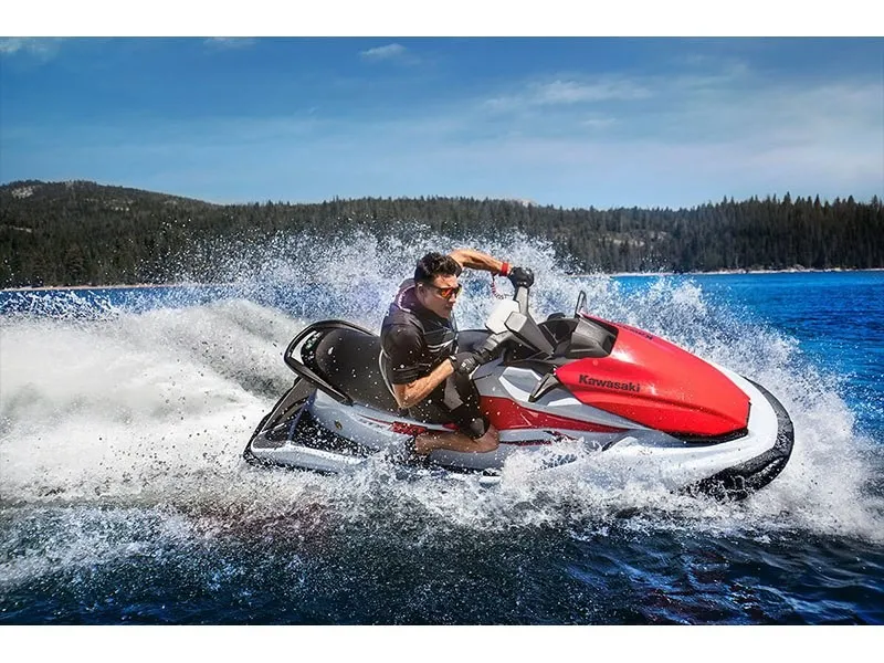 Slide: The Image of A red 2021 Kawasaki Jet Ski STX 160 speeds across the water, creating a splash. - 11