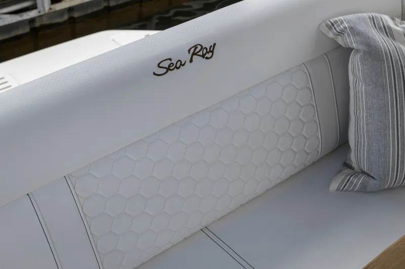 Slide: The Image of The 2027 Sea Ray Sundancer 320 features an elegant, upholstered bench with a striped cushion. - 30