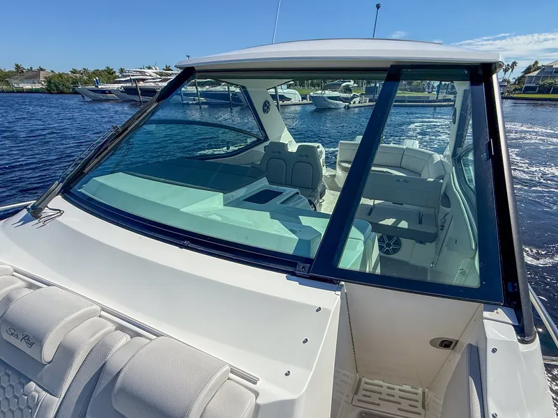 Slide: The Image of The 2027 Sea Ray Sundancer 320 Outboard features a modern design with a spacious cockpit and luxurious seating. - 15