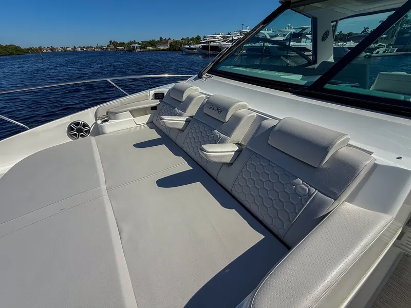 Slide: The Image of The 2027 Sea Ray Sundancer 320 Outboard features a spacious sun deck with comfortable cushions. - 14