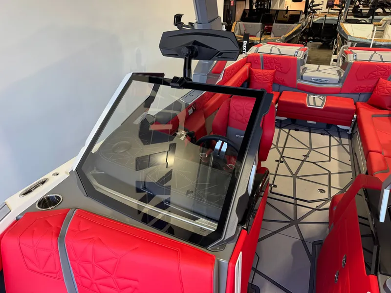 Slide: The Image of The image shows the cockpit of a Nautique Super Air Nautique G25 Paragon with red seating. - 22