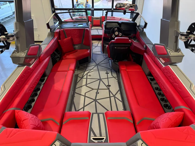 Slide: The Image of The image shows the interior of a 2027 Nautique Super Air Nautique G25 Paragon with red seating and modern design. - 15