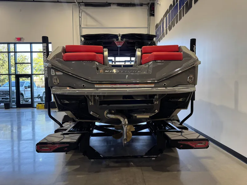 Slide: The Image of The image shows the rear of a Nautique Super Air Nautique G25 Paragon with red seats. - 6