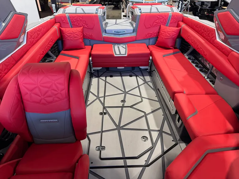 Slide: The Image of The image shows the luxurious red interior of a Nautique Super Air Nautique G25 Paragon boat. - 24