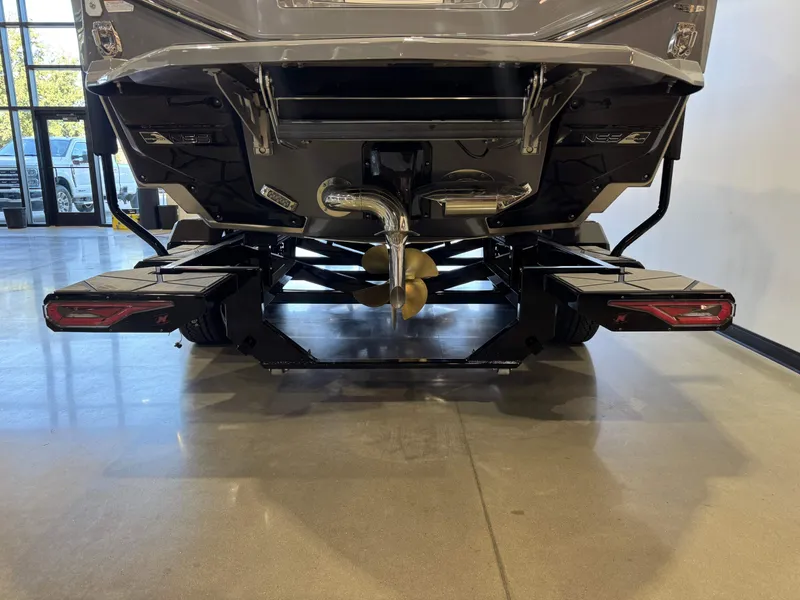Slide: The Image of The image shows the rear of a 2027 Nautique Super Air Nautique G25 Paragon with a propeller and platforms. - 7