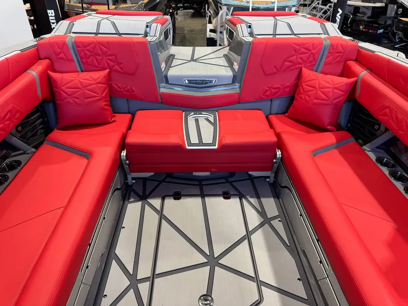 Slide: The Image of The image shows the interior of a 2027 Nautique Super Air Nautique G25 Paragon with red upholstery. - 29
