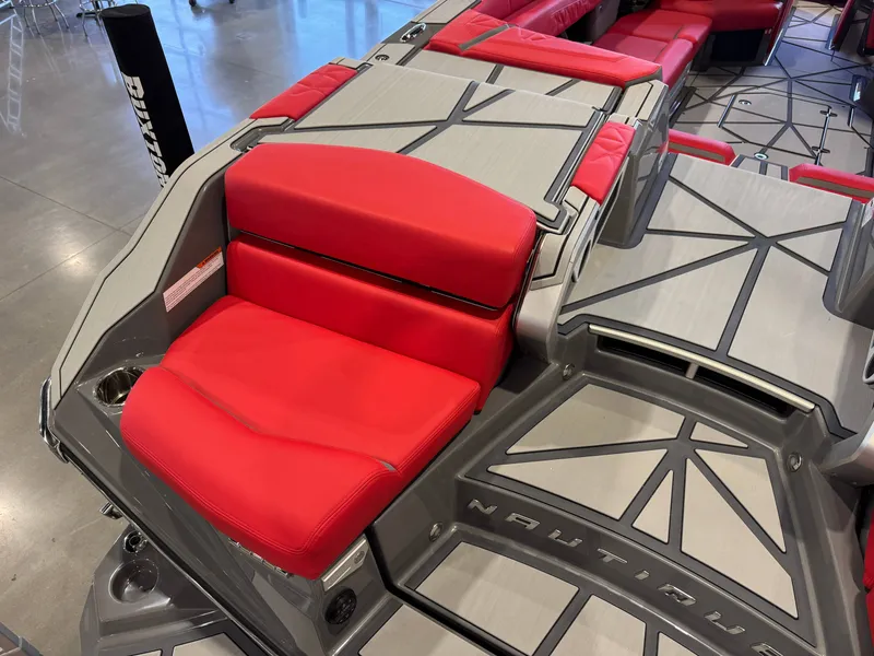 Slide: The Image of The image shows the interior of a Nautique Super Air Nautique G25 Paragon with red seating. - 11