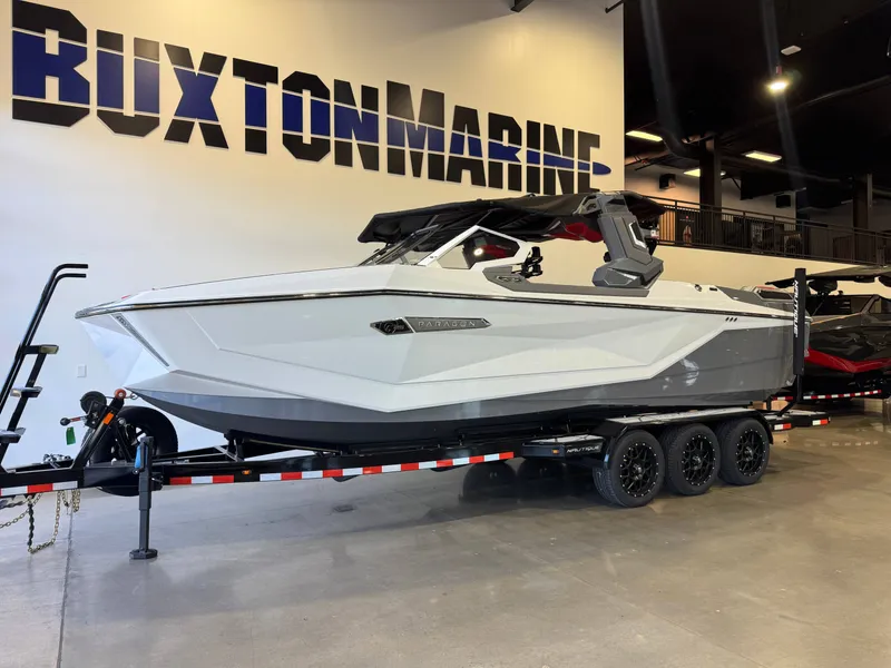 Slide: The Image of A 2027 Super Air Nautique G25 Paragon on a trailer in a showroom. - 3