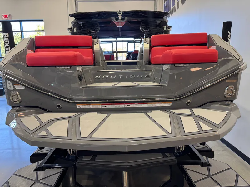 Slide: The Image of The image shows the rear of a gray Nautique Super Air Nautique G25 Paragon with red seats. - 8