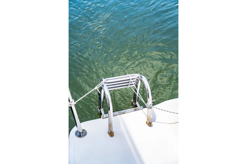 Slide: The Image of Boat ladder on St Francis SF 50, 2010 model, leading into clear water. - 66
