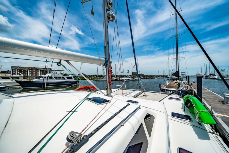 Slide: The Image of Sailboat docked at marina, St Francis SF 50, 2010 model, under clear blue sky. - 65