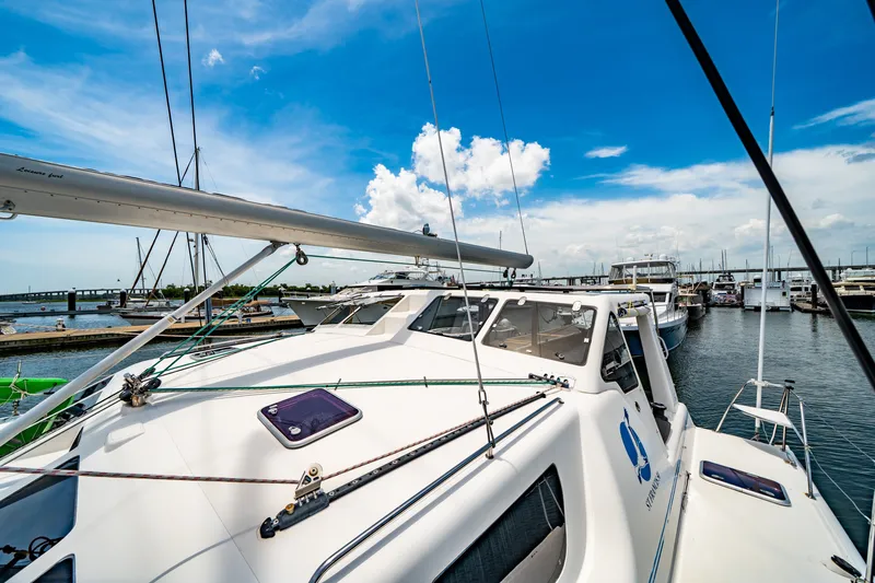 Slide: The Image of 2010 St Francis SF 50 catamaran docked at marina under clear blue sky. - 32